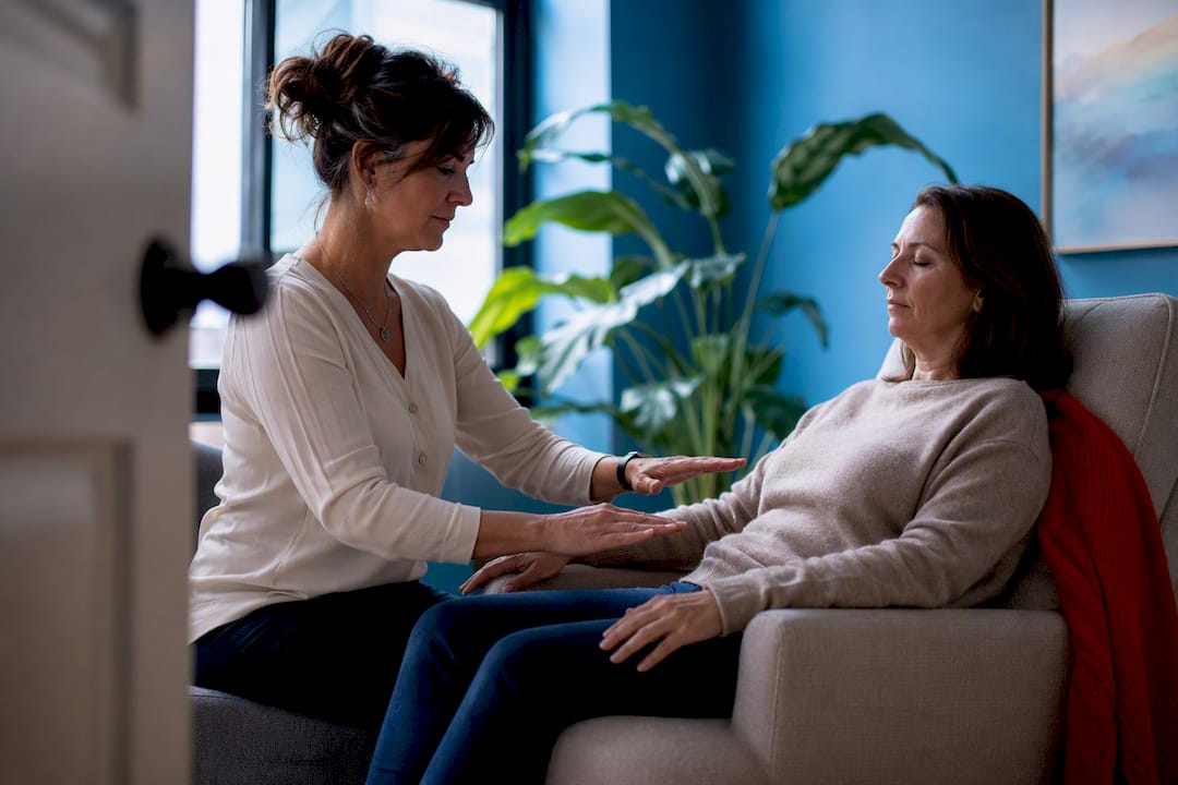 Clinician conducting a calm Reiki support session