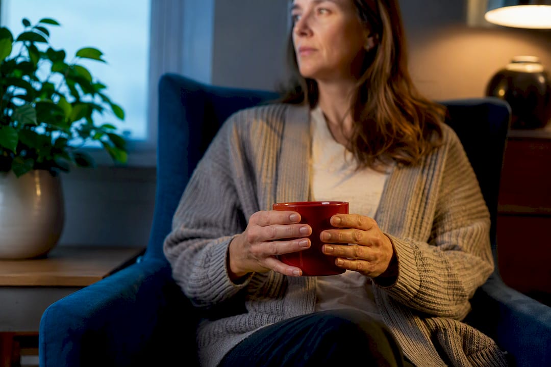 Person holding tea during grounding routine
