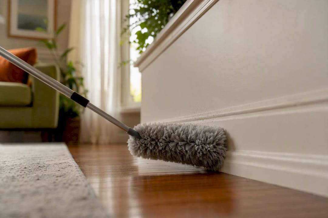 Extendable duster reaching baseboards