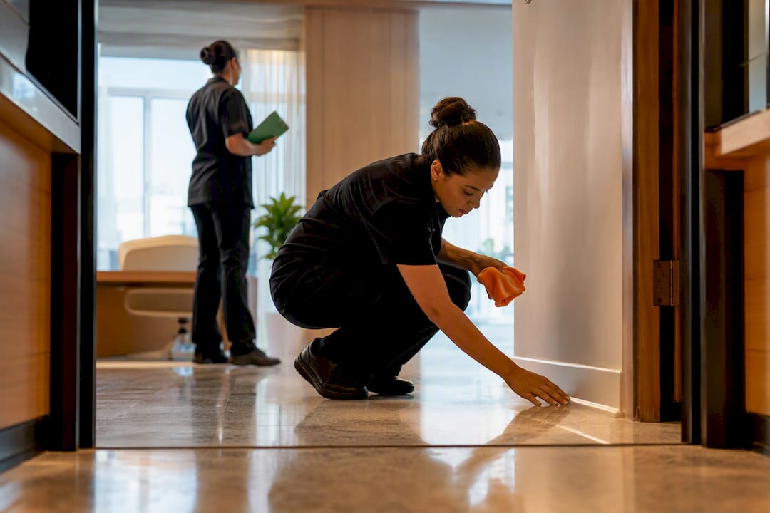 Cleaner documenting an office quality check