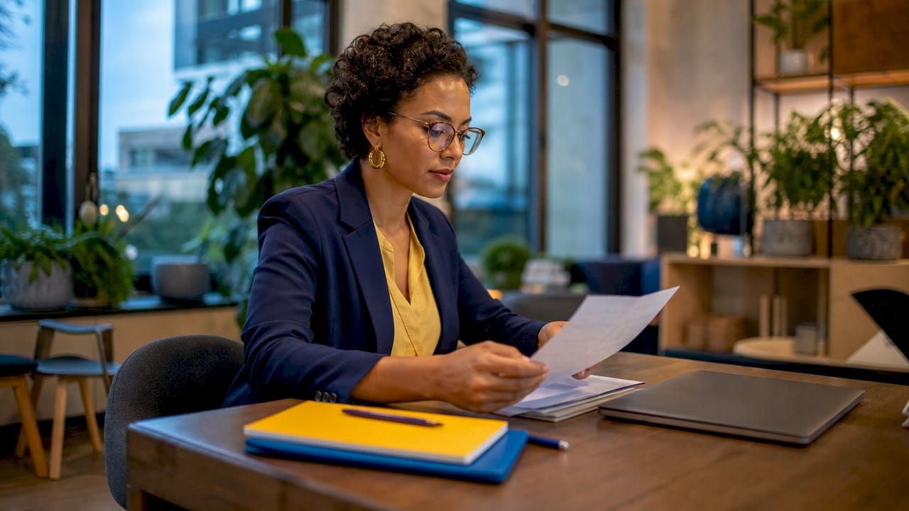 Professional reviewing SMART goal criteria documents