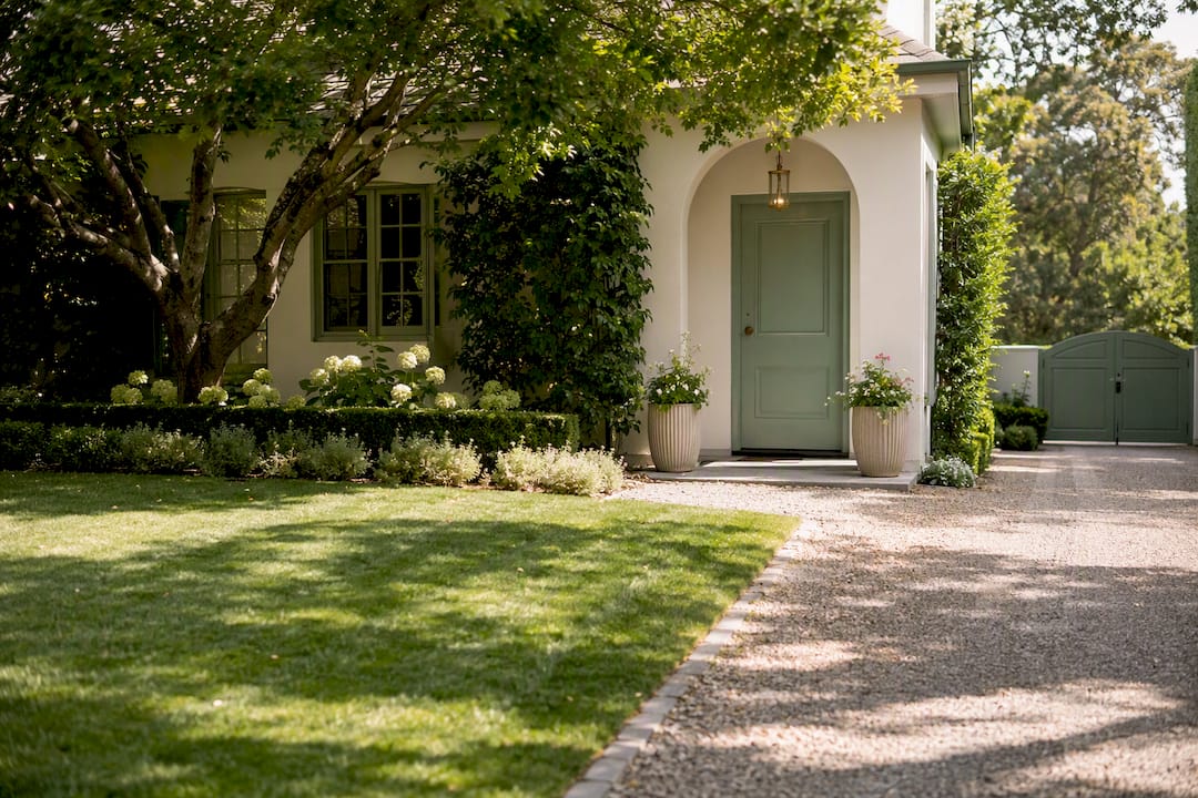 Freshly cleaned residential entry with planters