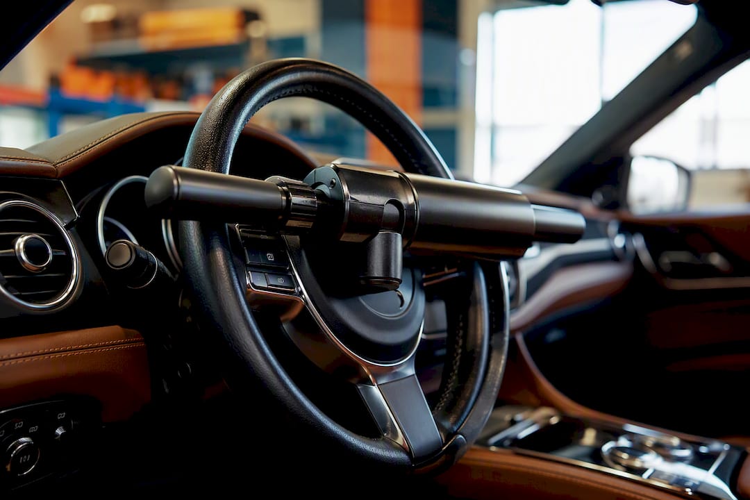 Steering wheel lock attached inside vehicle