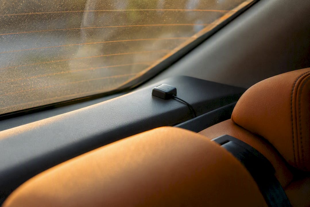 GPS antenna mounted near rear window inside vehicle