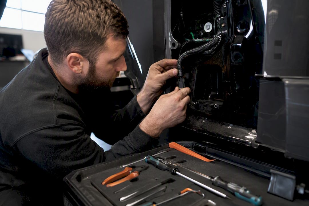 Engineer routing tracker wiring in vehicle