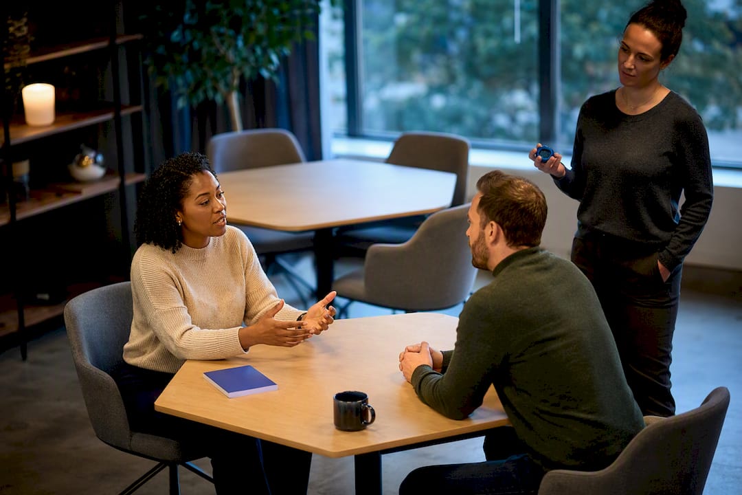 Learners practicing conversation in training workshop