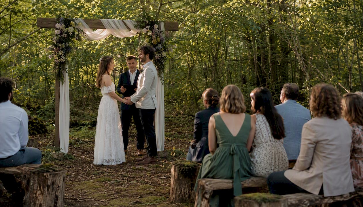 Woodland outdoor wedding ceremony scene