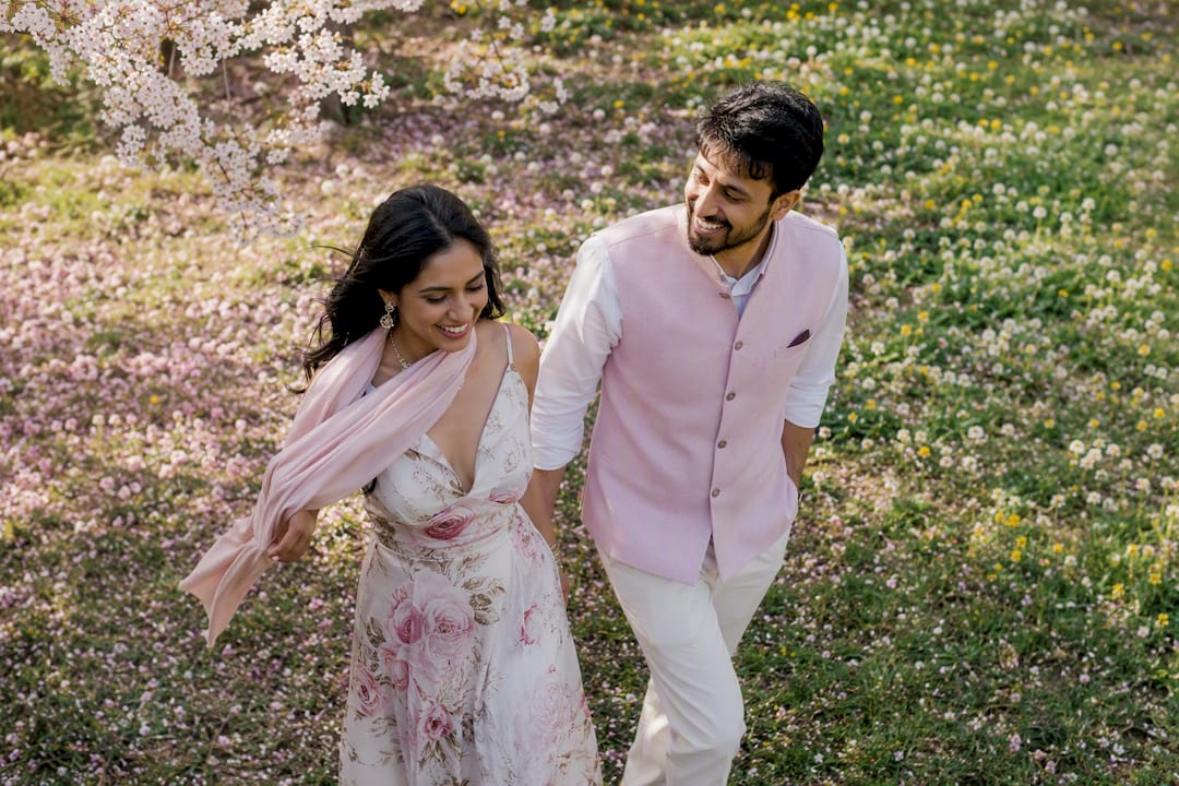 Couple in light pastel spring outfits outdoors