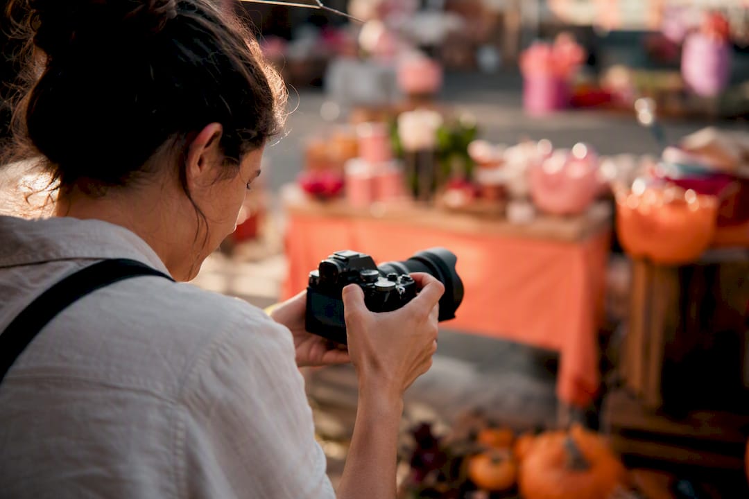 Photographer adjusting camera on seasonal product shoot