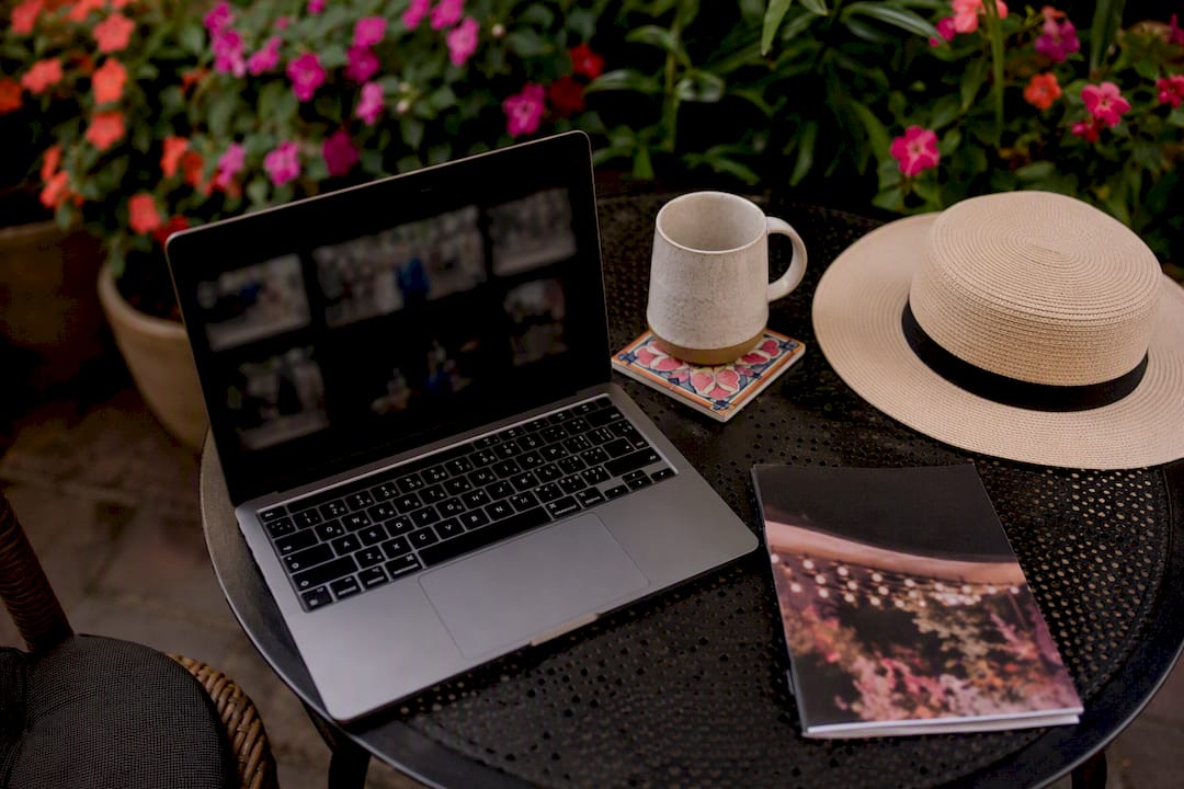 Laptop and coffee for event photo review