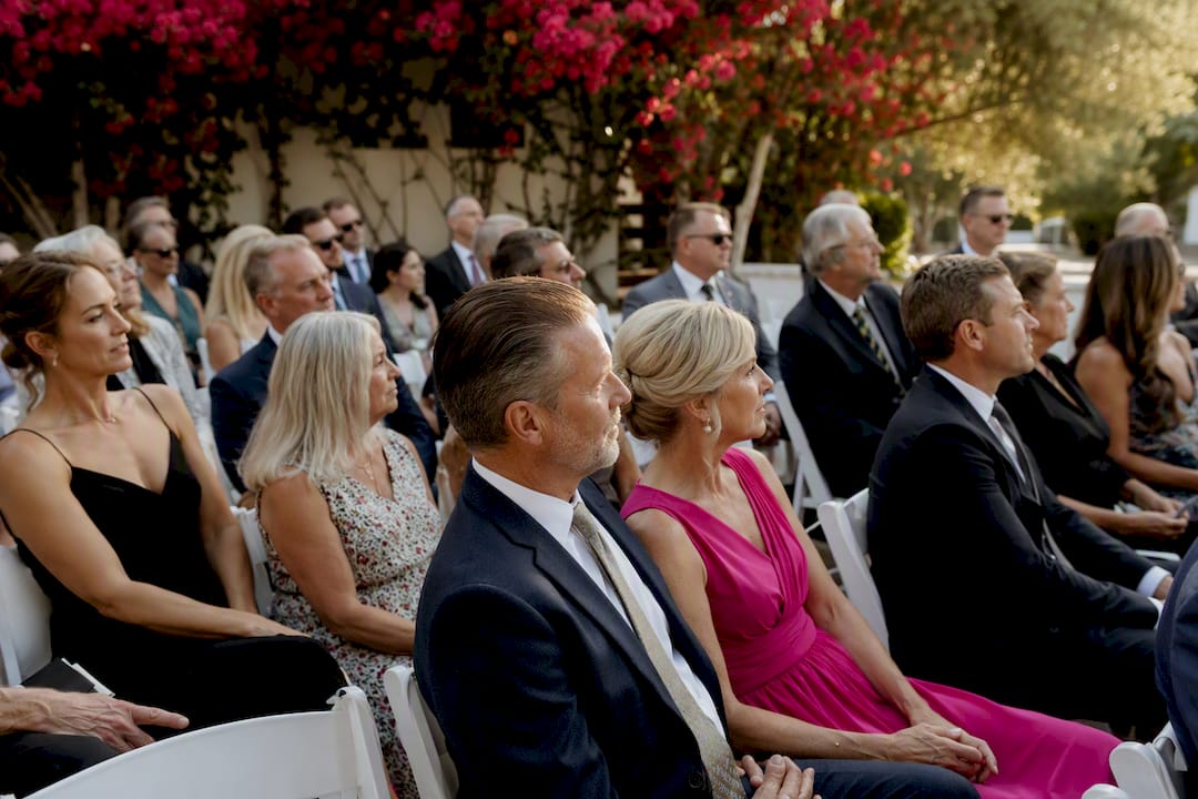 Wedding guests engaged, no phones visible