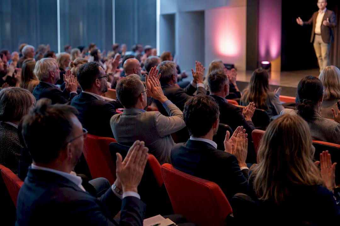 Audience applauding during a business event