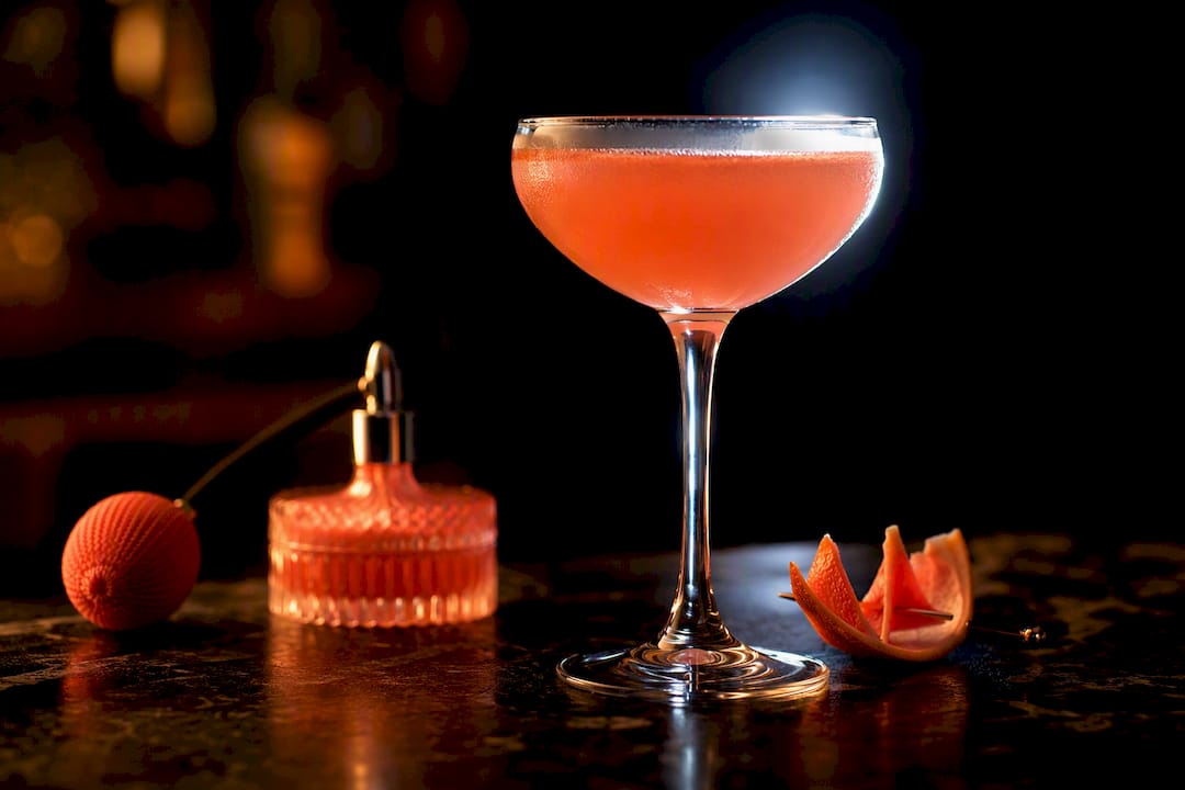 Dramatic cocktail photography setup with rim light