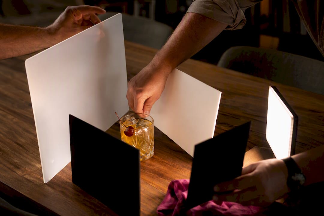 Light control tools arranged around cocktail glass