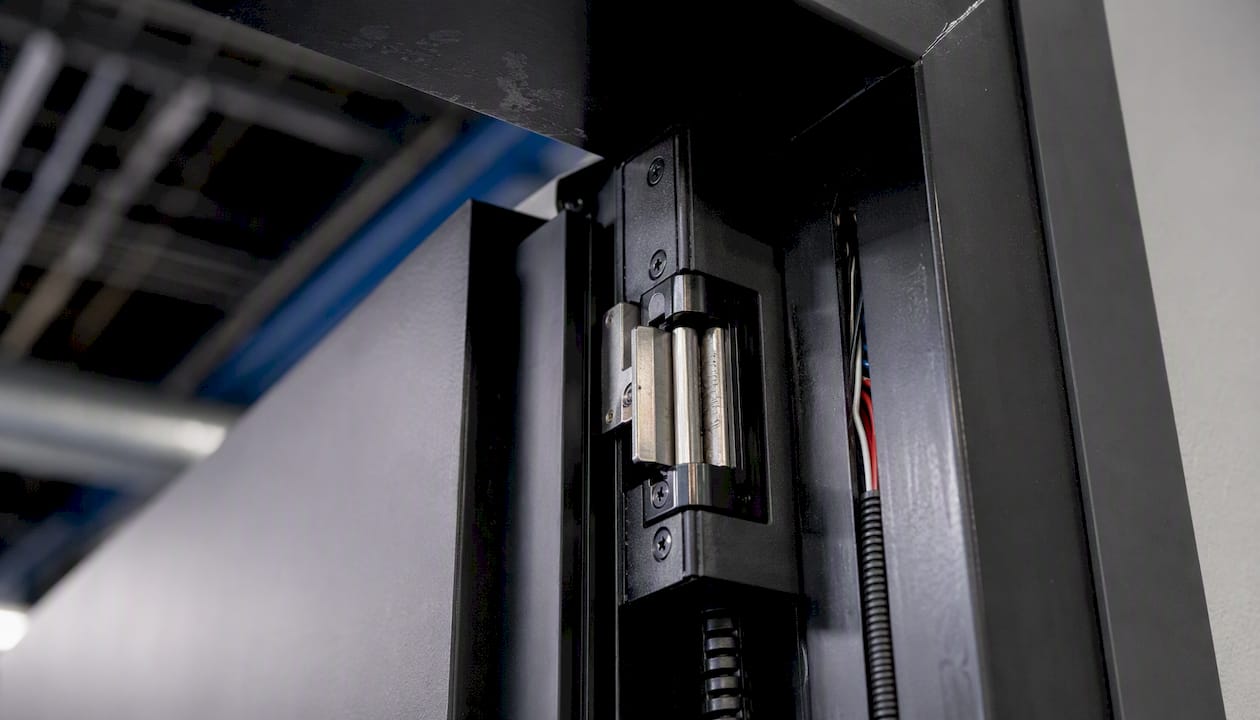 Electric strike mechanism in door frame