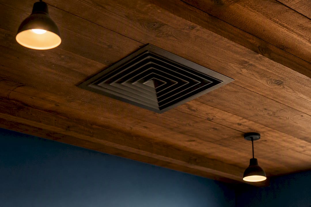 Close-up of HVAC vent in meeting room ceiling