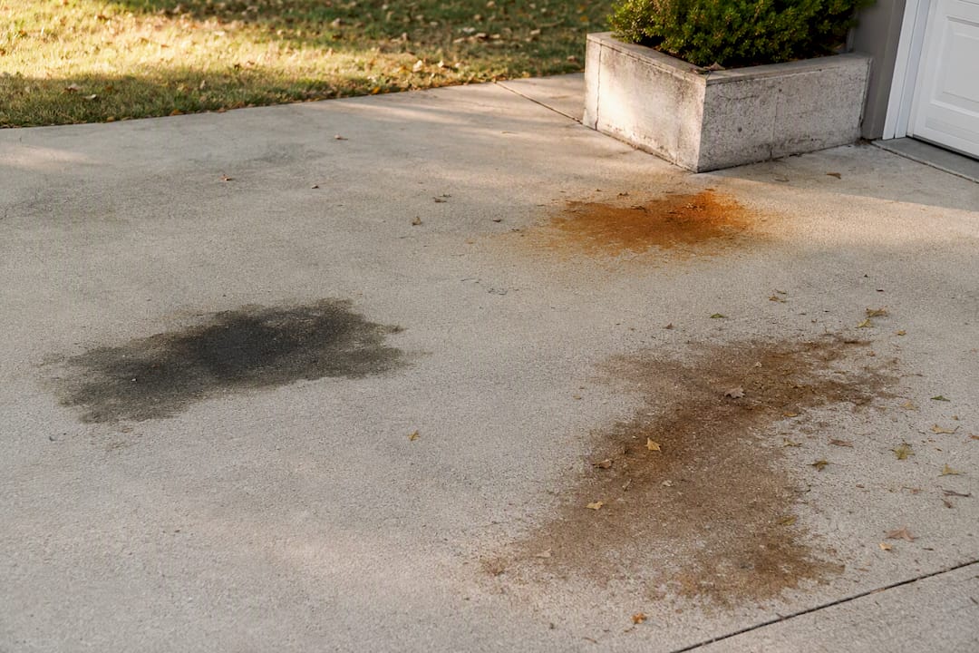 Comparison of leaf, rust, and oil stains on concrete