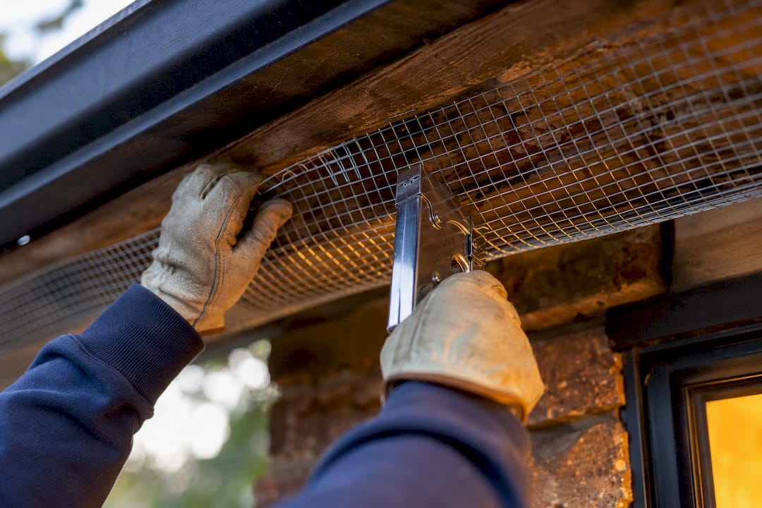 Installing hardware cloth under eaves