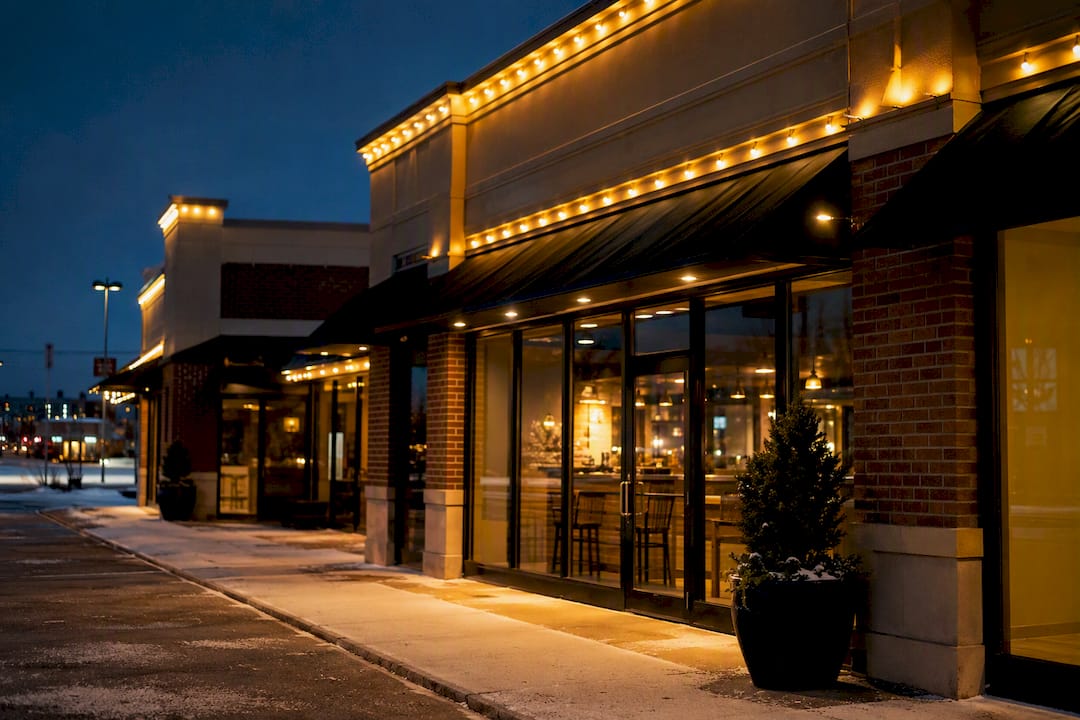 Evenly lit commercial storefront at dusk