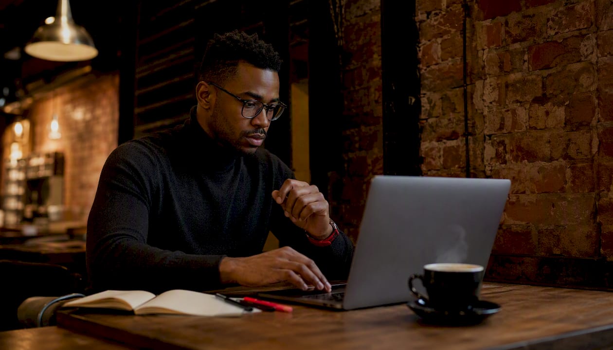 Man installing browser extension on laptop