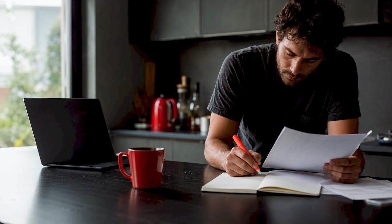 Researcher reviewing AI tools and notes