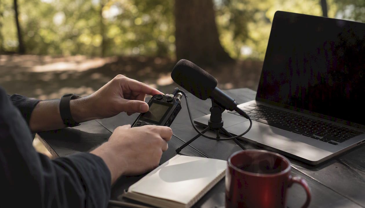 Close-up of hands recording interview audio