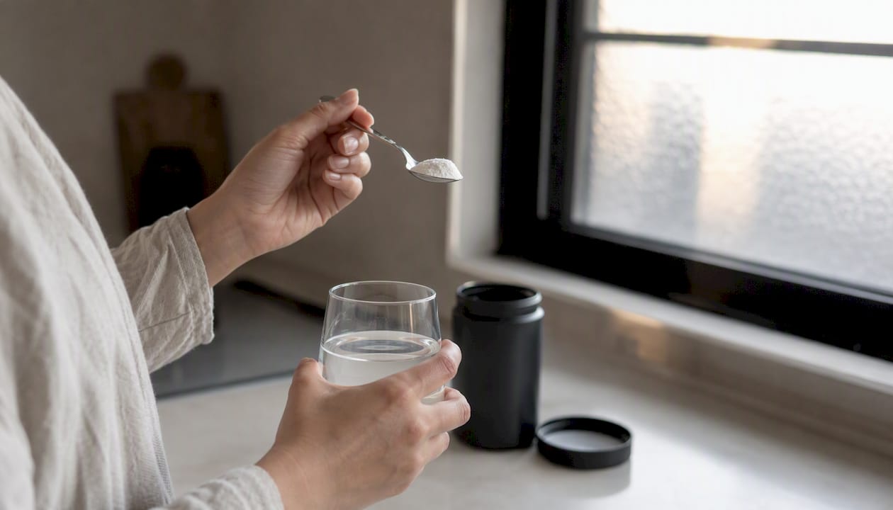 Person cautiously taking probiotic supplement powder