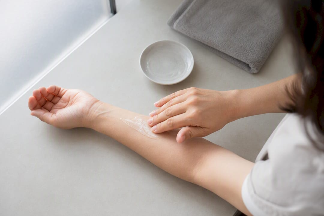 Cream applied to forearm for topical skin care