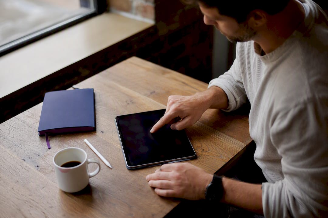Person interacting with decision simulation tablet