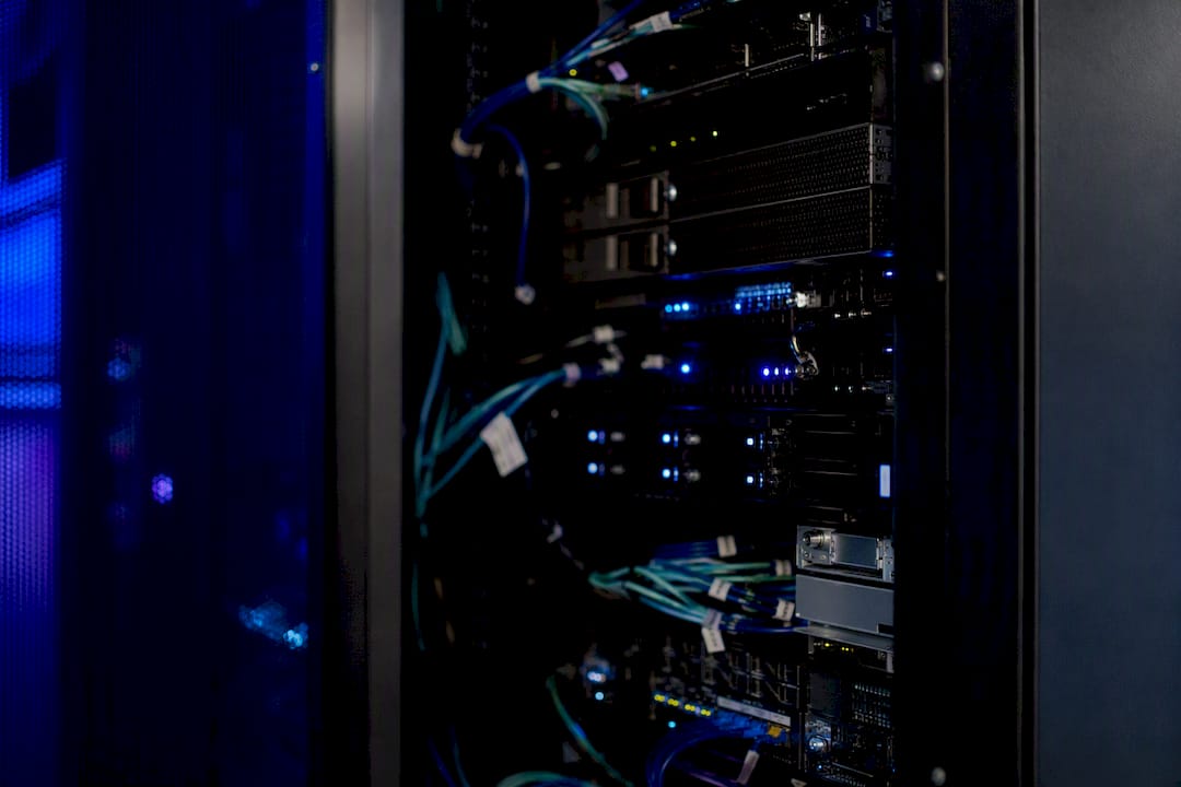 Dimly lit data server rack with purple accent lights