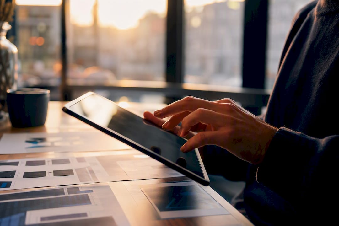 Hands interacting with tablet for capability diagnosis