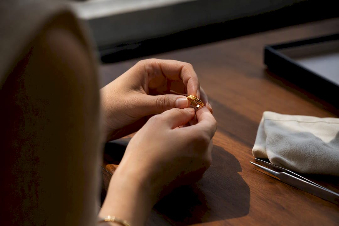 Close inspection of gold vermeil ring under lamp