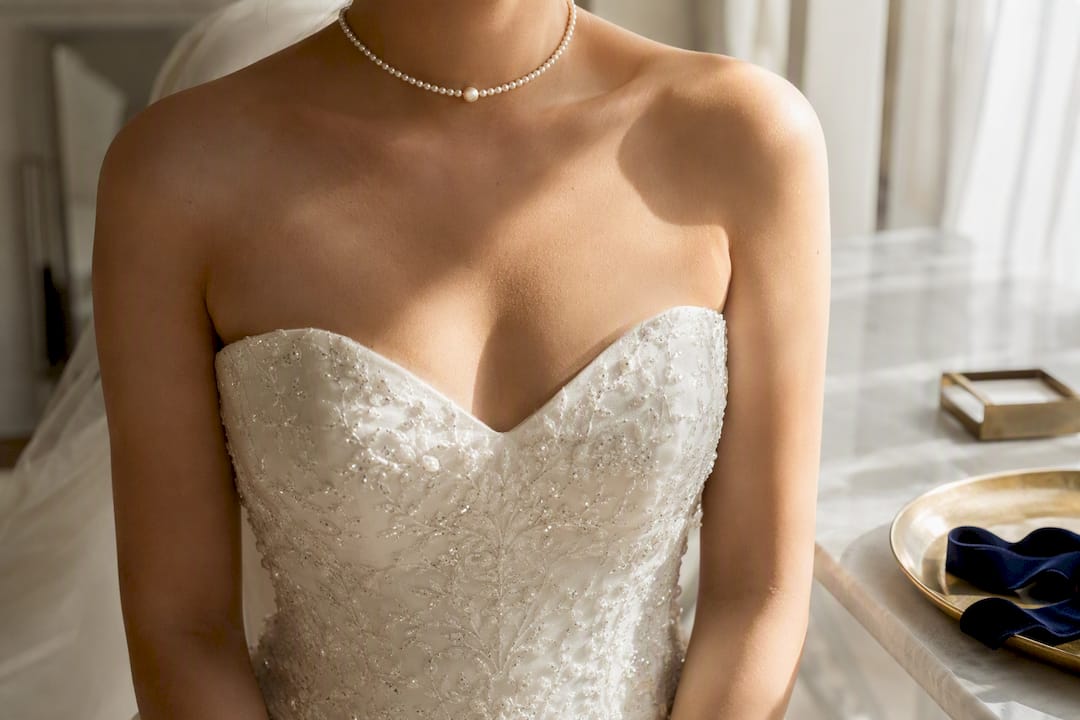 Pearl choker styled with sweetheart neckline