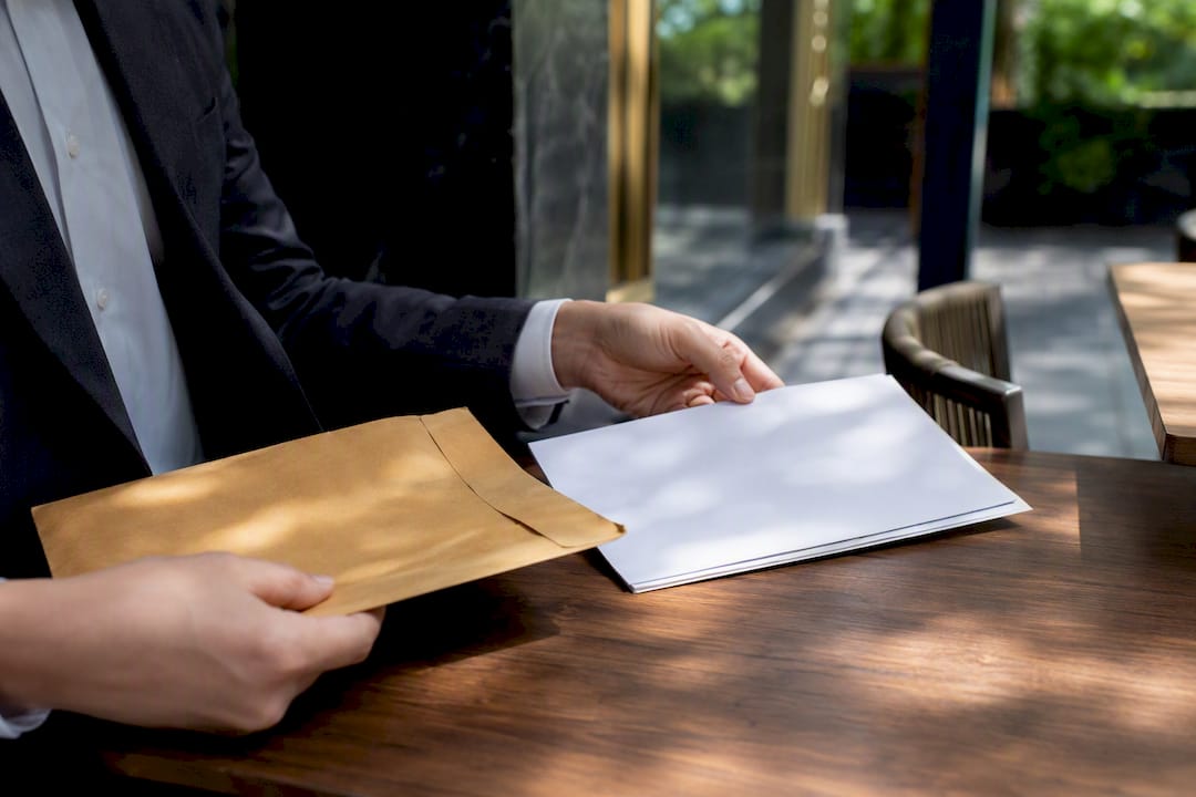 Hands placing corporate executor documents