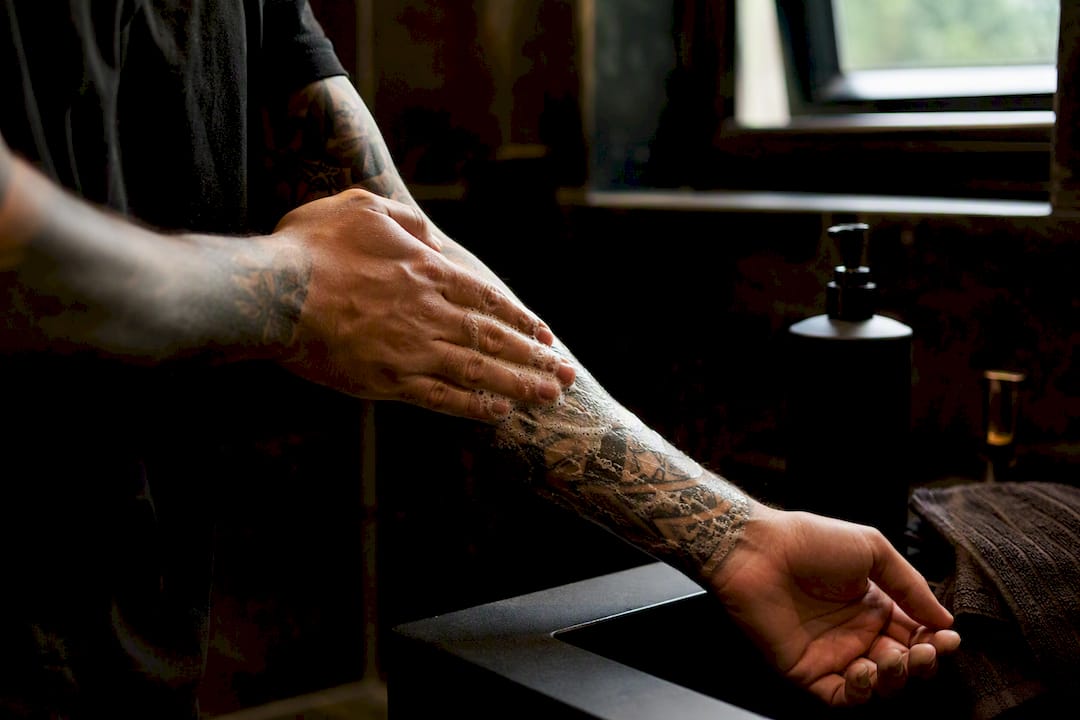 Hands cleansing tattoo with foaming soap