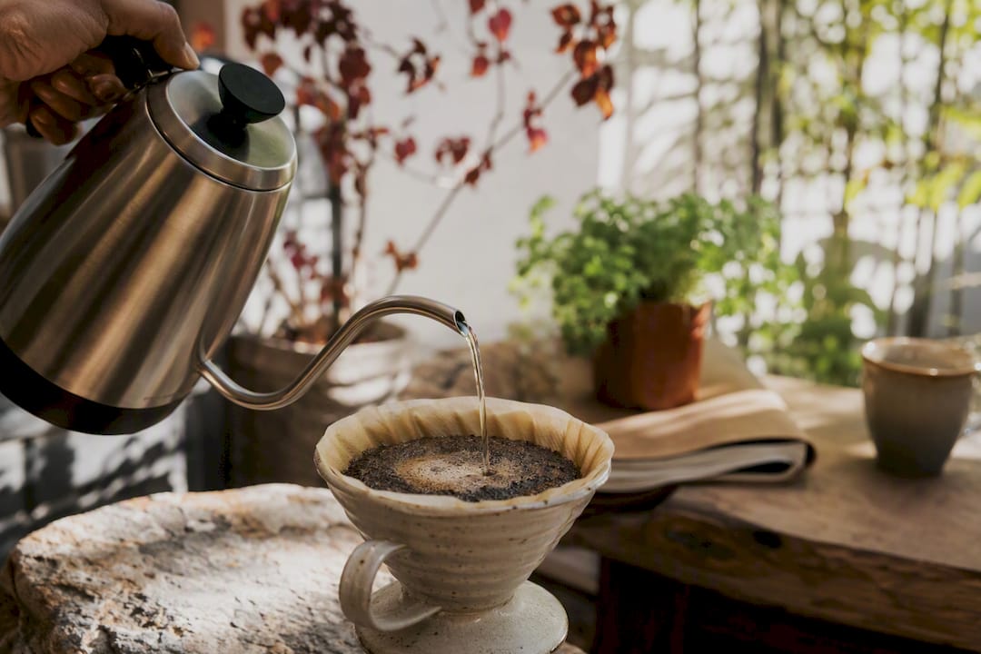 Controlled bloom pour over coffee grounds