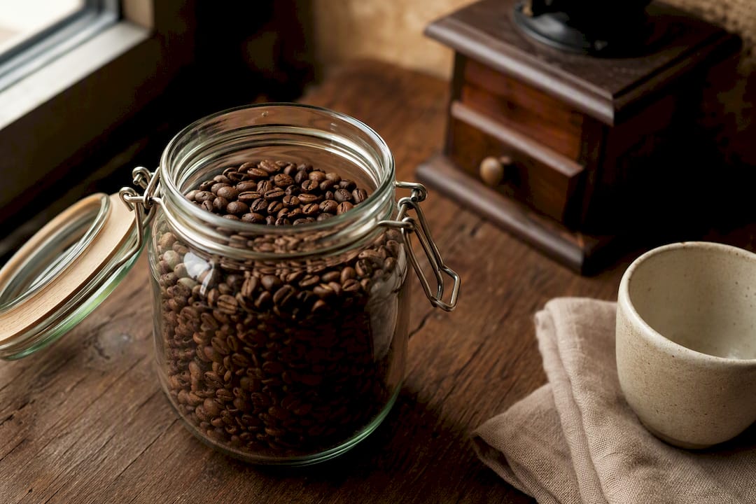 Fresh roasted coffee beans in glass jar