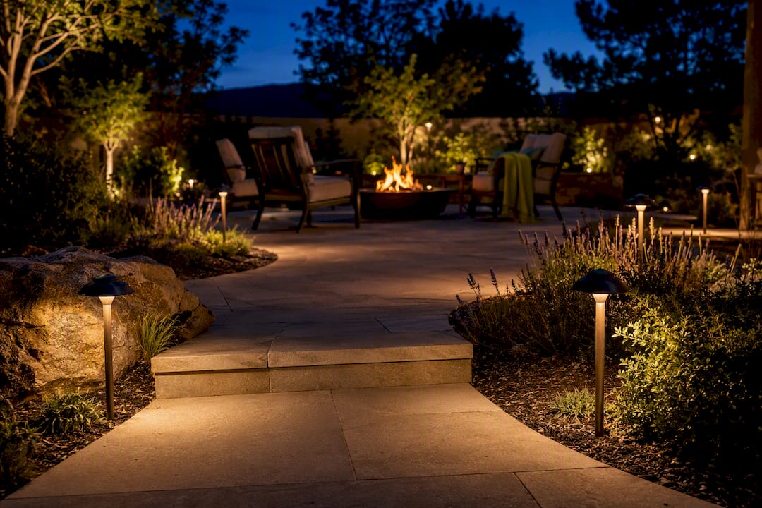 Path lights illuminate fire pit walkway