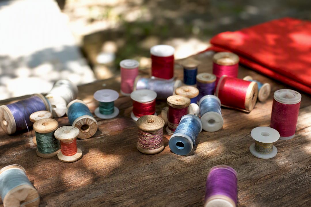 Different bobbins wound with various thread weights