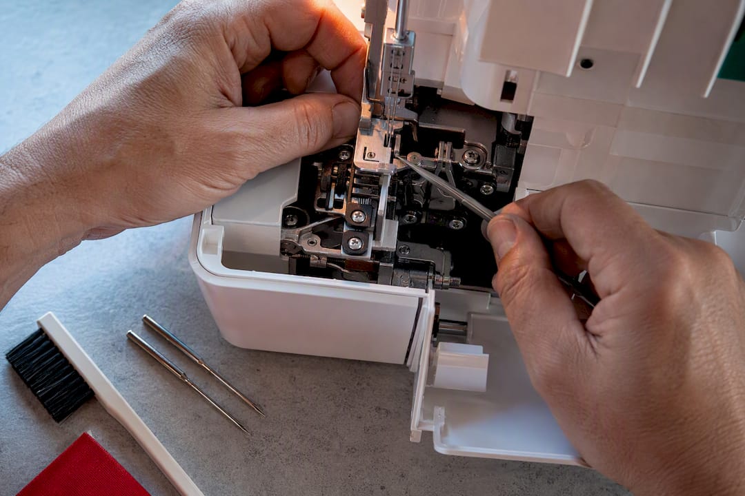 Serger blade and needle screw access