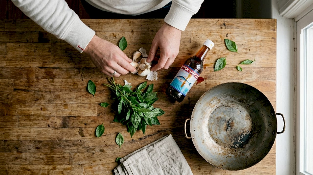 Essential Thai basil recipe ingredients on counter