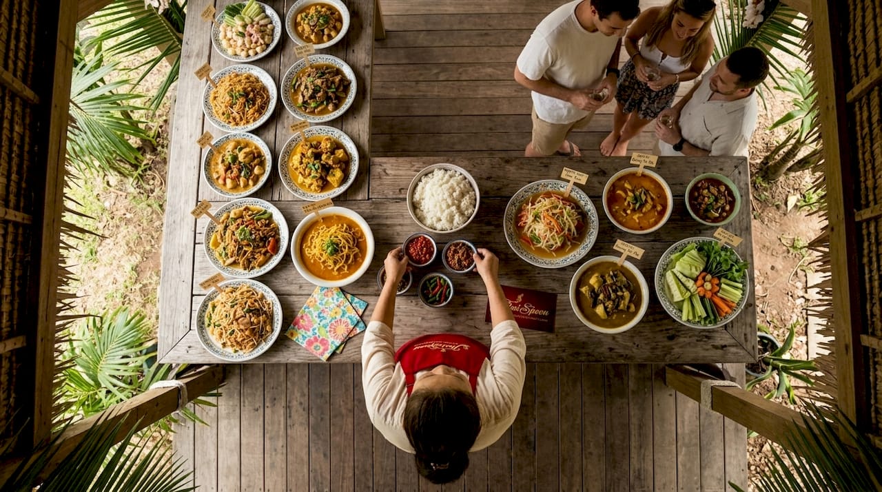 Regional Thai dishes on wooden festival table