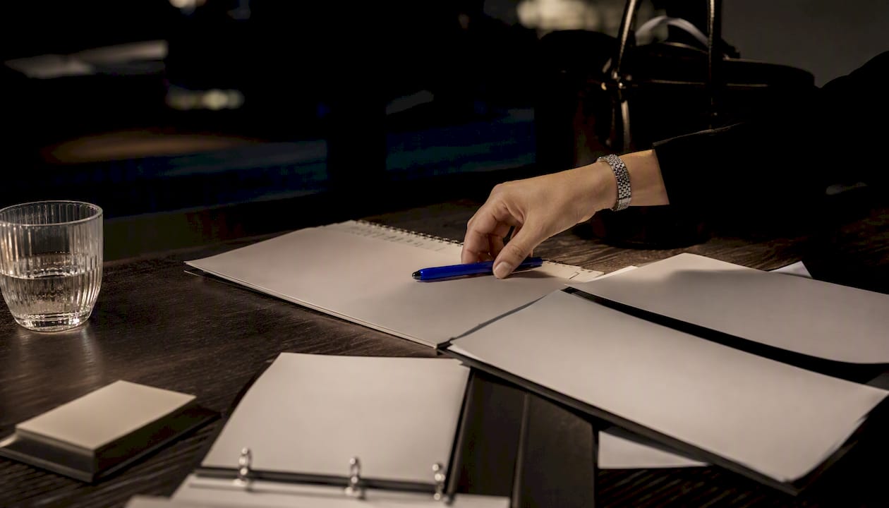 Campaign approval workflow documents on desk