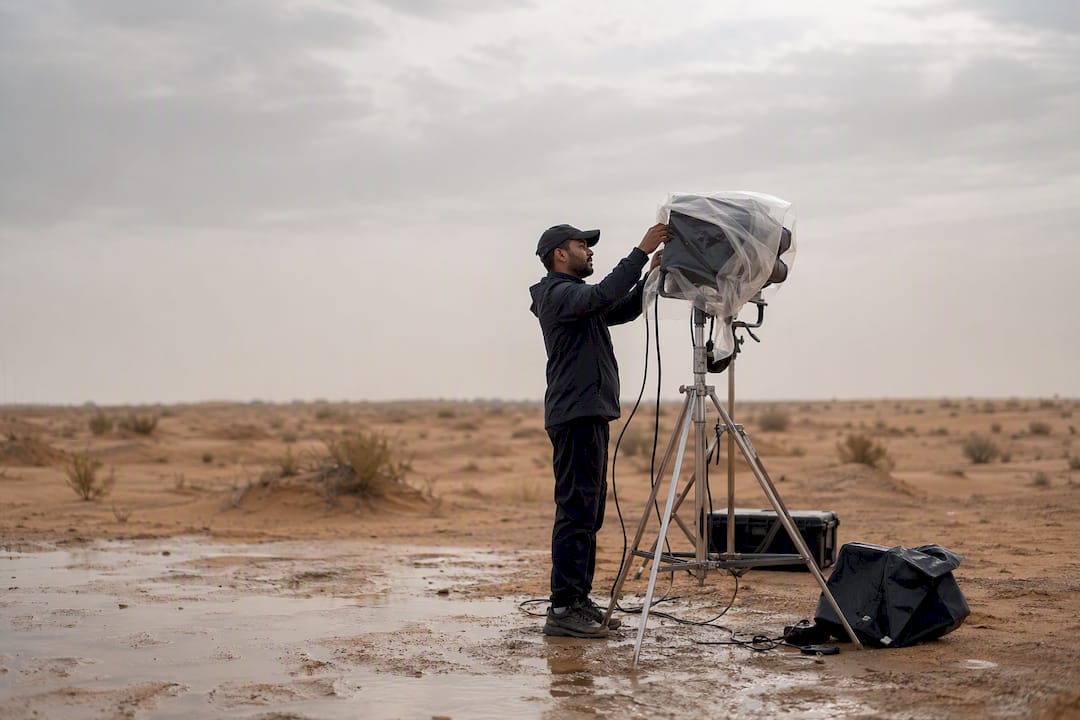 Crew securing weather protection on outdoor shoot
