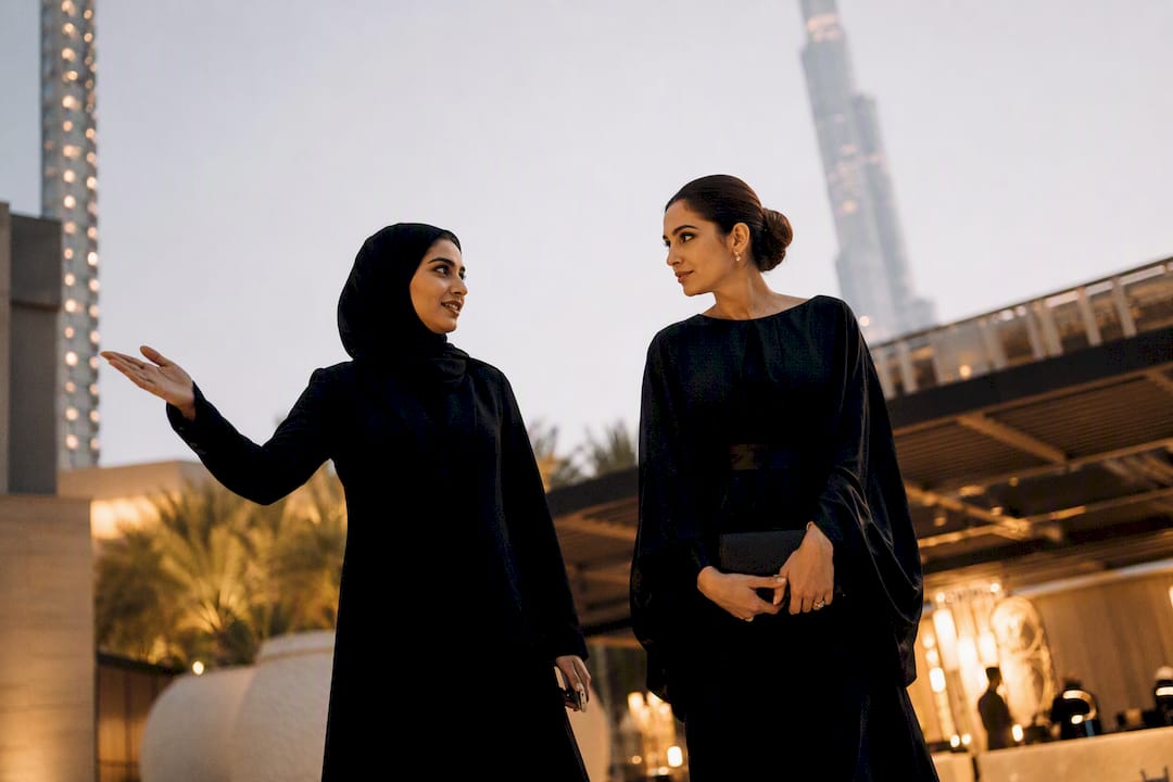 Hostess escorting VIP guest at gala event