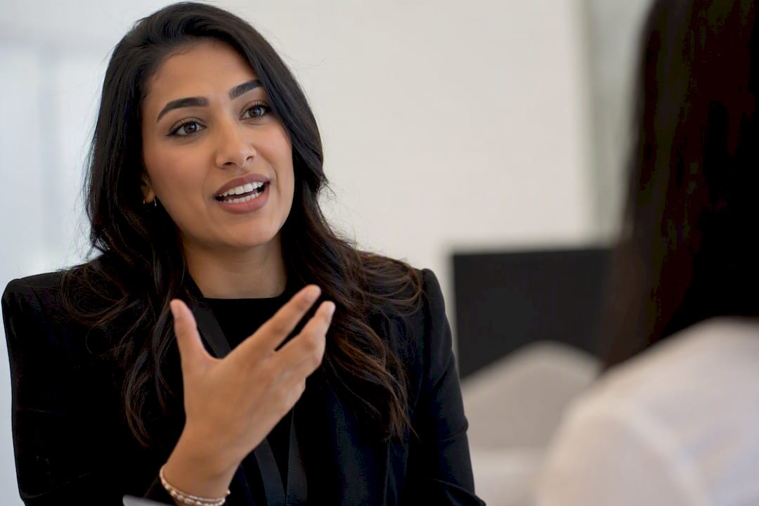 Hostess communicating confidently at event