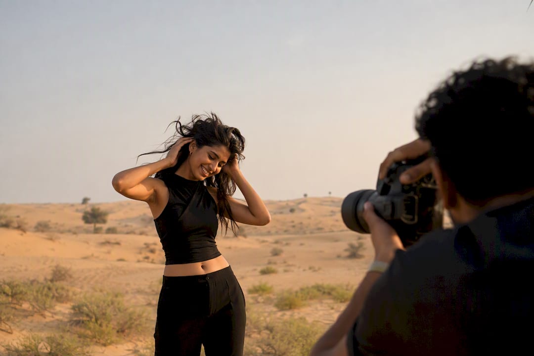 Model adjusting hair during portrait session