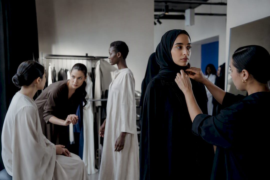Models and stylists preparing specialty comp card shoot