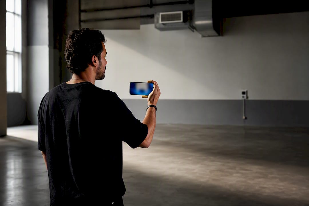 Scout recording ambient sound on location