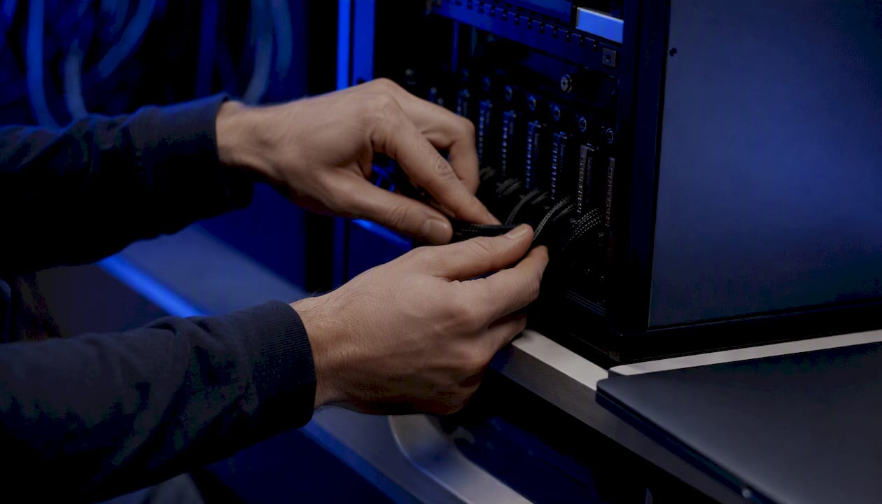 Hands connecting wiring inside data hardware unit